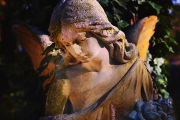 Majestic view of statue of golden angel illuminated by sunlight