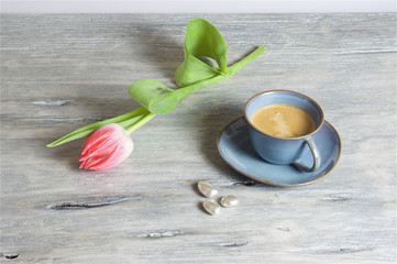 Coffee in a blue cup - grey background