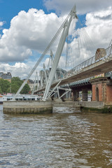 Fototapeta na wymiar LONDON, ENGLAND - JUNE 15 2016: Hungerford Bridge and Thames River, London, England, United Kingdom