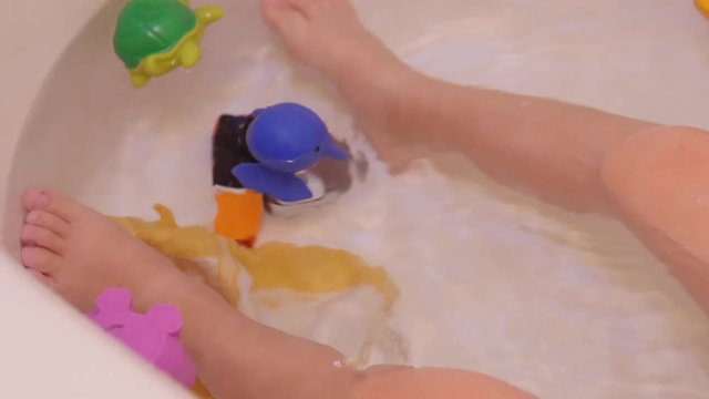 A little boys feet in a bathtub