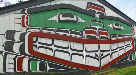 Haida painting on side of cedar house, Thunderbird Park, Victoria, BC, Canada