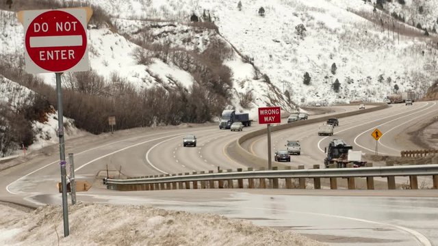 Trucks and cars drive on I-80