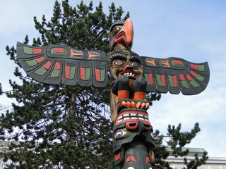 Totem pole topped  by thunderbird, Thunderbird Park, Victoria, BC, Canada