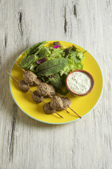 Keftedes, greek veal meatballs served with tzatziki sauce 