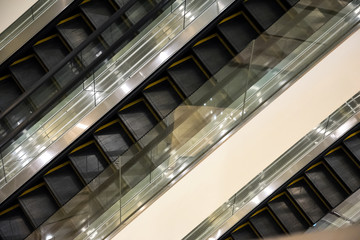 Escalators stairway inside modern office building.