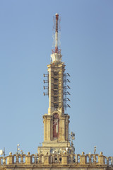 Obraz premium Telecommunication tower with satellite dishes and radio antennas on top of the House of the Free Press (Casa Presei Libere), in Bucharest city, Romania.
