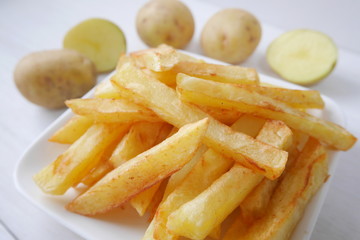 Homemade french fries raw organic potatoes from a home garden
