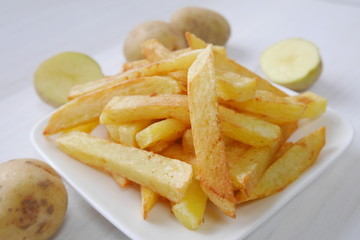 Homemade french fries raw organic potatoes from a home garden