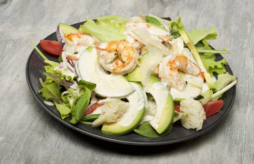 Caesar salad with prawns and avocado