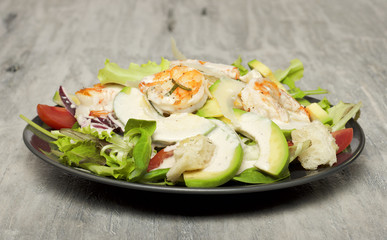 Caesar salad with prawns and avocado