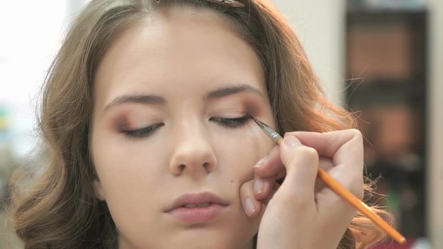 Beautiful model gets a professional makeup