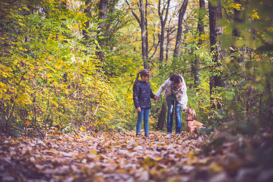 Mother and daughter hiking in a forest