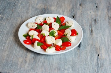 Caprese salad on a white platel