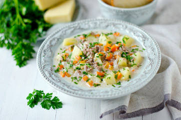 Cheese soup with vegetables and minced meat