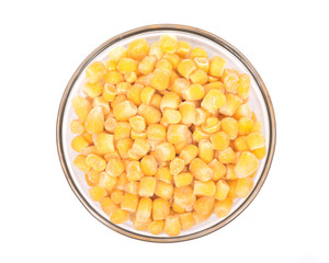 Frozen organic super sweet cut corn in bowl isolated on white background