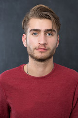 Young man in studio looking at camera