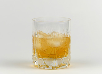 Glass of whiskey isolated on white background