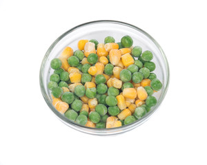 Frozen organic peas and corn bowl isolated on white background