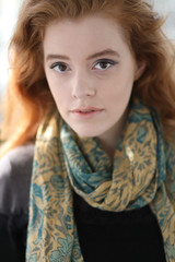 Red Haired Woman in Blue and Gold Scarf