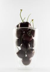 Fresh cherry fruits in glass.