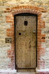 Wooden Door in Stone Building