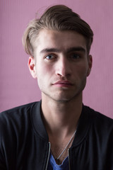 Obraz premium Portrait of an handsome young man with interesting background a