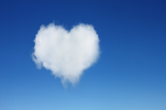 one heart shaped cloud on blue sky