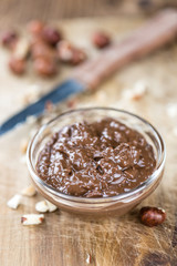 Bowl with Chocolate Cream (on wooden background)