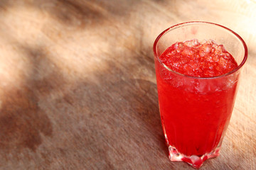 Red juice on the cold wooden floor..