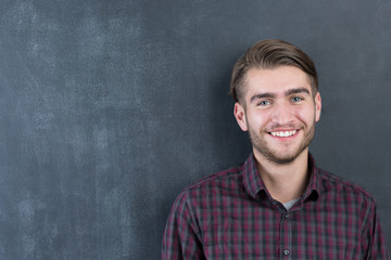Young man in studio looking at camera