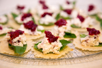 red and green party snacks on a glass plate