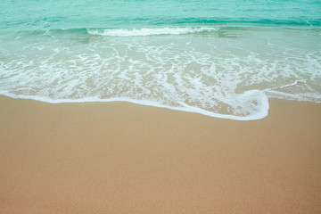 Wave on the sandy beach