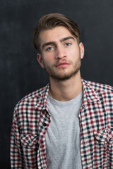 Obraz premium Portrait of a cheerful young man in checkered shirt