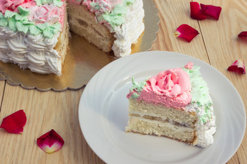 piece of sponge cake  with curd cream  and banana on  background