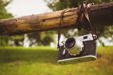 Old retro camera on the background of the Carpathian Mountains