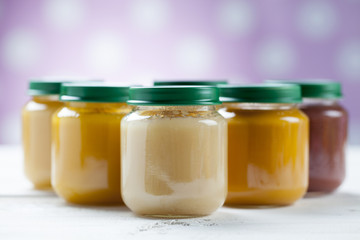 healthy ready-made baby food on a wooden table