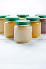healthy ready-made baby food on a wooden table