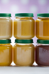 healthy ready-made baby food on a wooden table