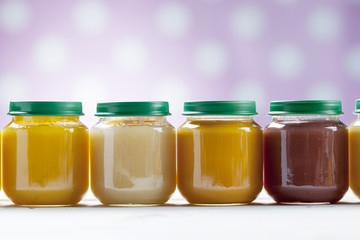 healthy ready-made baby food on a wooden table