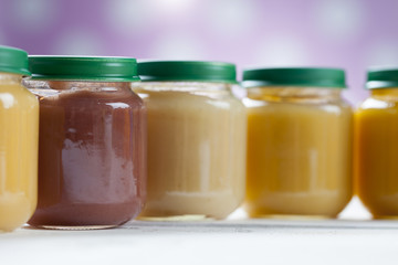 healthy ready-made baby food on a wooden table