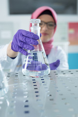 muslim lab worker doing an analysis
