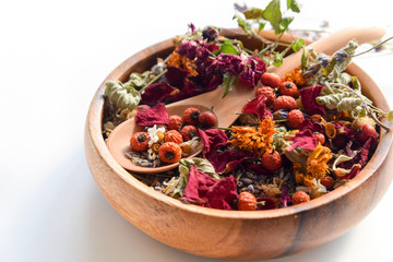 dried herbs in wooden bowl