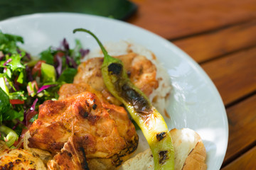 Meat and vegetables on a white plate