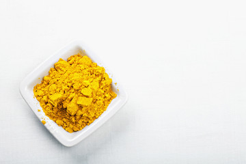 Saffron spice in white dish above view