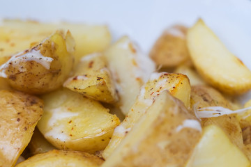 Baked potato slices with spices