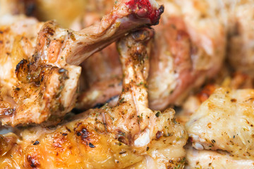 Appetizing fried chicken legs on the grill, background