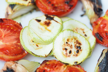 Tomatoes, zucchini and onions fried  on the grill