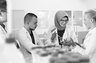 group of scientists working at the laboratory