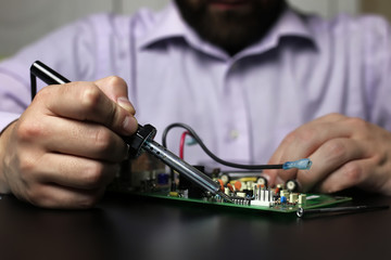 chip soldering man hands
