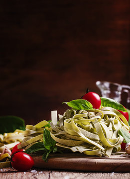 Ingredients for cooking pasta with spinach, garlic and olive oil